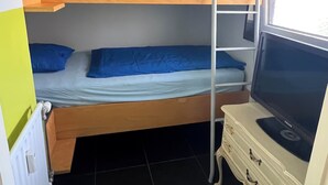 A bunk bed room with a TV on a dresser. - Natural paradise for hikers & cyclists Aachen border triangle (La Calamine)