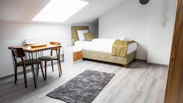 Desk, laptop workspace, blackout curtains, iron/ironing board