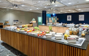 A buffet with various food items and a coffee station. - Voco Dusseldorf Seestern An Ihg Hotel (Düsseldorf)