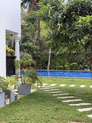 Comfort Triple Room, Pool View | Property grounds - Riverside Cabanas (Mirissa)