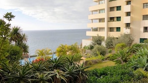 A multi-story building with balconies overlooking a body of water. - Superior Rentals - Beachfront Penthouse (free parking) (Funchal)