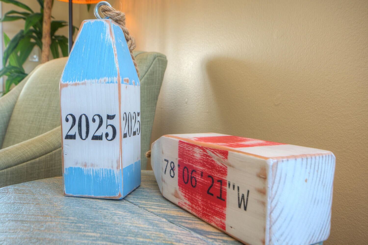 Two wooden blocks with numbers and letters, placed on a table.
