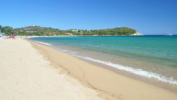 On the beach, white sand, beach towels