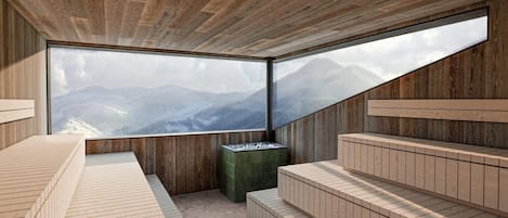 En modern inredning med ett stort fönster som ger utsikt över bergen, trägolv och inbyggda sittplatser.