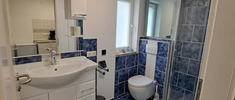 Shower, towels, soap, toilet paper