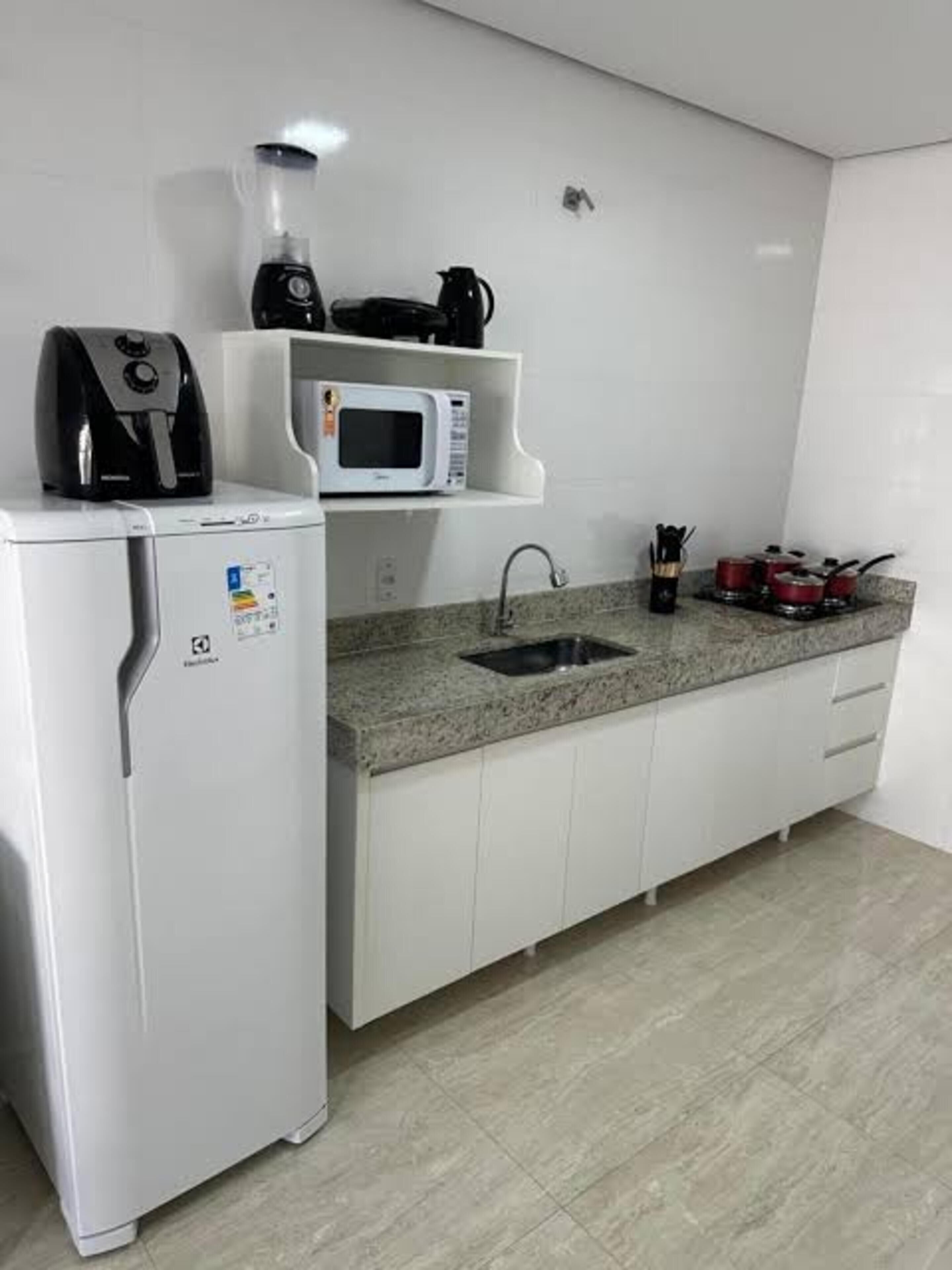 Apartamento conforto, vista para a piscina | Cozinha privada