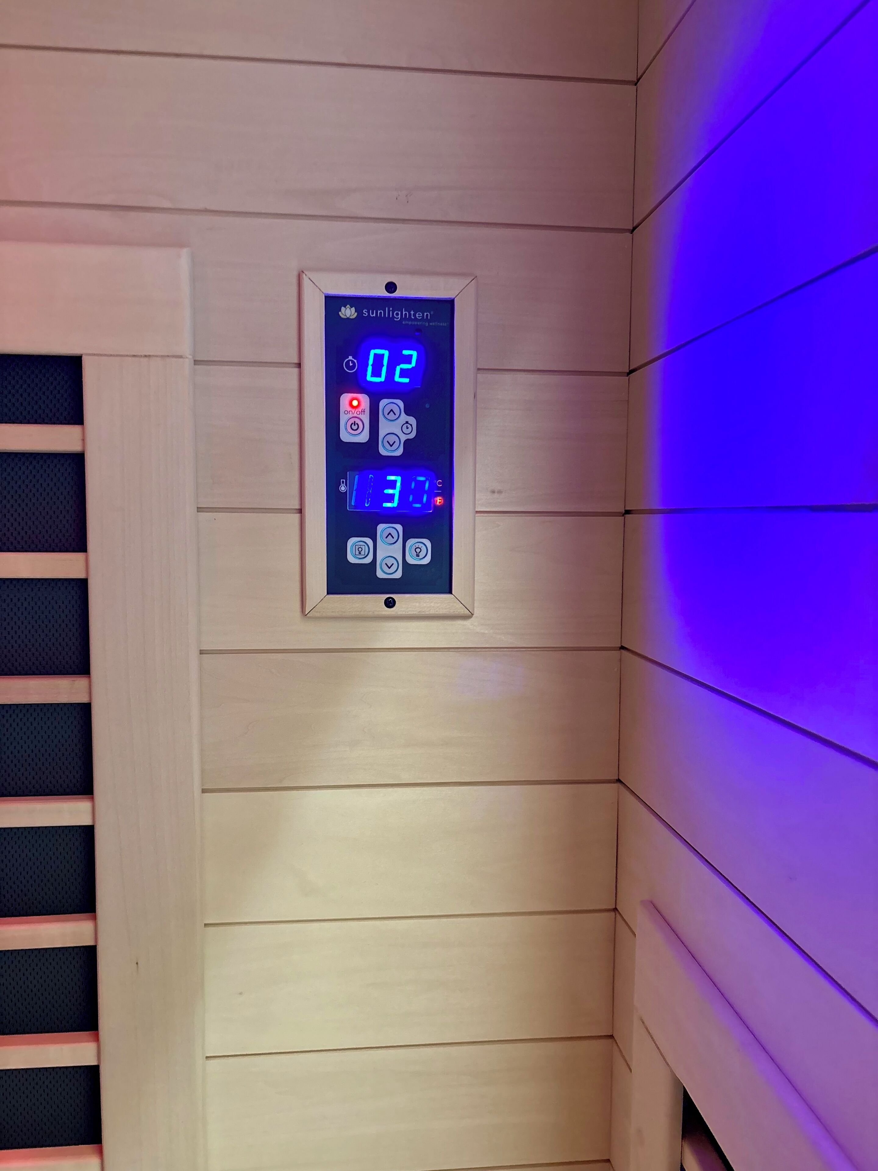 A digital control panel with time and temperature settings, a power button, and a lock function.