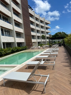 Outdoor pool, a heated pool - Distrito Norte condo 1-bedroom in beautiful Cozumel with Large swimming pool (Cozumel)