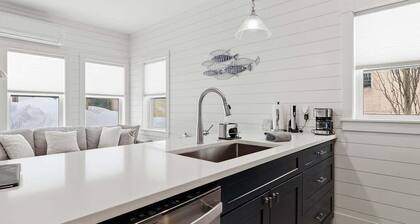 Overlooking the Pine River Channel with large rooftop deck