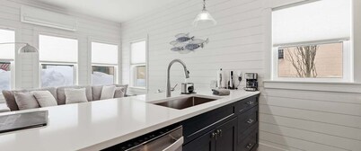 Overlooking the Pine River Channel with large rooftop deck