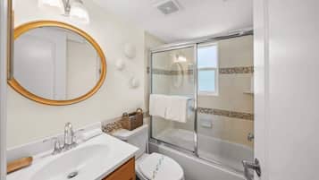 Shower, hair dryer, towels, shampoo