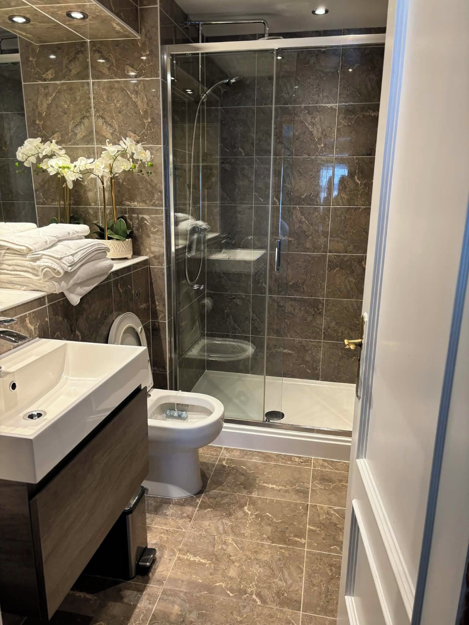 Shower, hair dryer, towels, soap