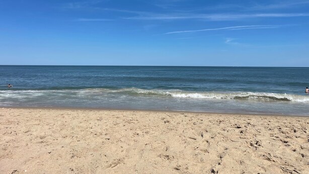 A beach with a clear sky and calm sea. - Cozy Little Slice of OCMD Heaven (Ocean City)