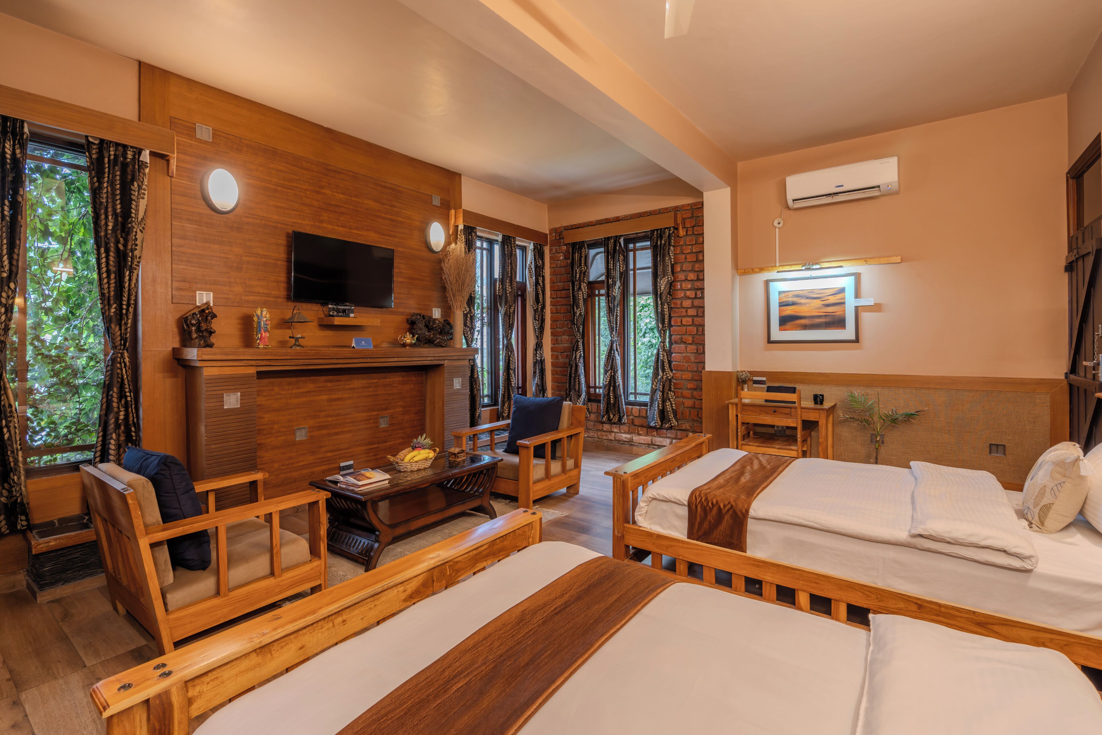 A room with wooden furniture, a flat-screen TV, and a fireplace.