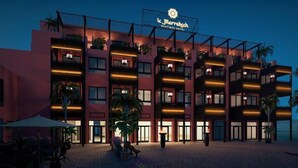 A multi-story hotel with balconies, a crescent moon in the sky, and a sign reading "Marrakech Boutique Hotel". - Le Marrakech Boutique Hotel (Kleinblittersdorf)