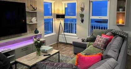 New south facing lodge, amazing sea views, town amenities and beaches nearby.