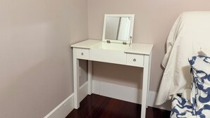 A white dresser with a mirror, two drawers, and a small cabinet. - Stylish 2BR Suite 2 Queen Beds 20 Min to YVR (Vancouver)