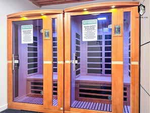 Two wooden sauna cabinets with safety instructions and control panels. - `Celebrating Elvis` Loft - Steps from Main St (Memphis)