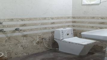 Shower, towels, soap, toilet paper