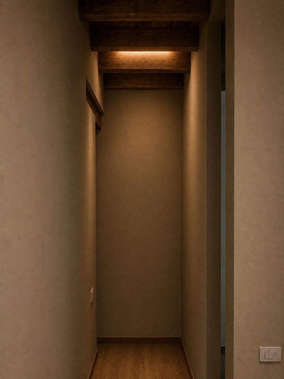 A narrow hallway with a wooden ceiling and a light fixture.