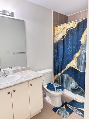 Shower, hair dryer, towels, soap