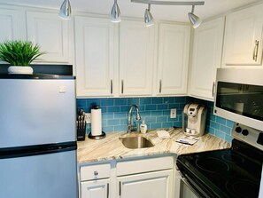 Fridge, microwave, oven, stovetop - Palmetto Breeze Retreat. Oceanfront. Pet Friendly. (Myrtle Beach)