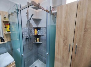 Shower, hair dryer, towels, soap