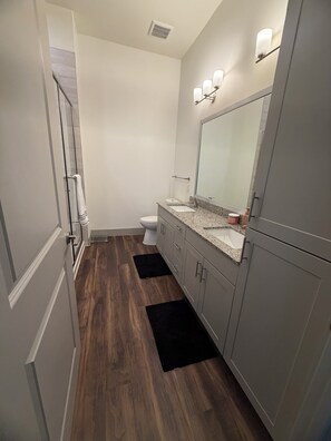 Shower, hair dryer, towels, toilet paper