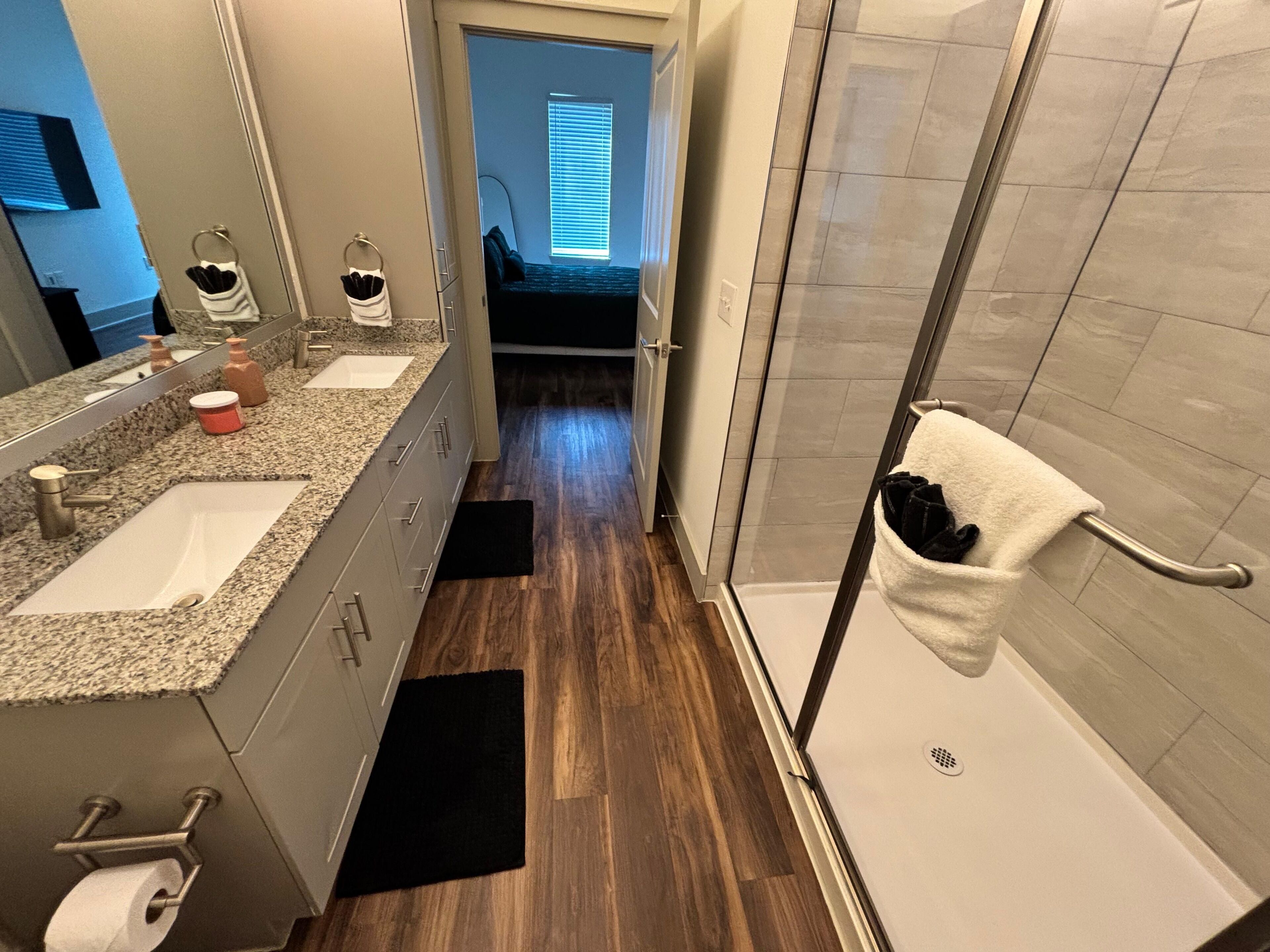 Shower, hair dryer, towels, toilet paper