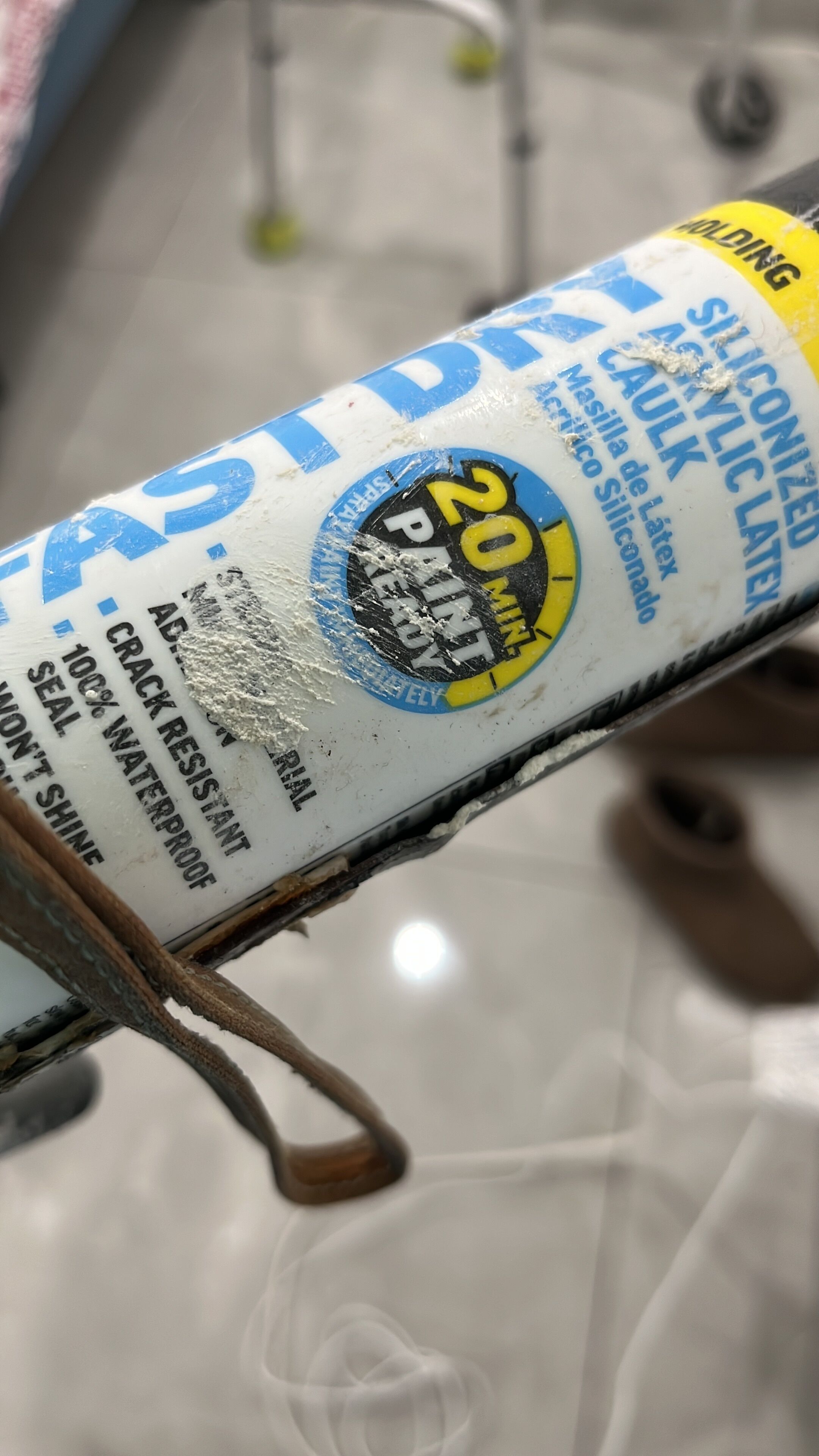 A close-up of a white and blue object with text and a yellow label.