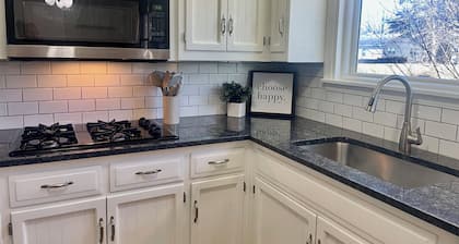 Charming 3-bedroom house in peaceful Overland Park with garage and yard!