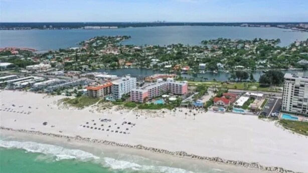 A coastal resort area with beachfront properties, a marina, and a view of the ocean. - Pet Friendly, St. Pete Beach Condo w/AC, 1BR+Sofa Bed, Steps to Beach! (St. Pete Beach)