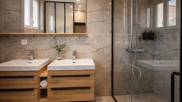 Shower, hair dryer, towels, toilet paper