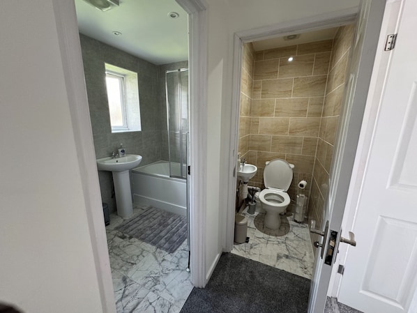 Shower, hair dryer, towels, soap