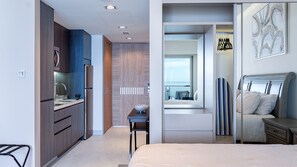 A modern hotel room with a kitchenette, a dining area, and a bed. - One 1404A Studio– State-of-the-Art Resort Offering Unmatched Luxury and Sea of Cortez Scenery (Puerto Peñasco)