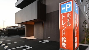 A modern building with a parking sign indicating a hotel. - Hotel Trend Suzuka (Suzuka)