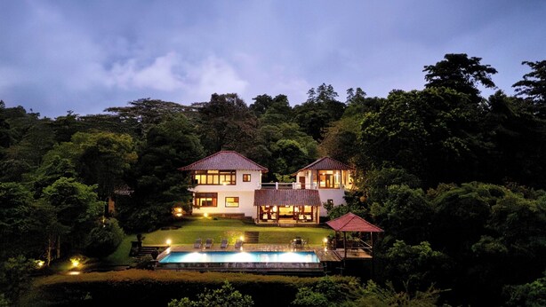 A two-story house with a swimming pool, surrounded by lush greenery. - Kandy Knightsdale Villa (Menikhinna)