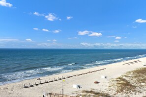 A beach with a row of beach huts and a clear view of the ocean. - Gulf Front 2/2 Flash sale 3rd floor unit PPE6311 (Gulf Shores)