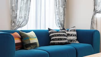 Superior Villa, Balcony, City View | Living area | 50-inch flat-screen TV with cable channels