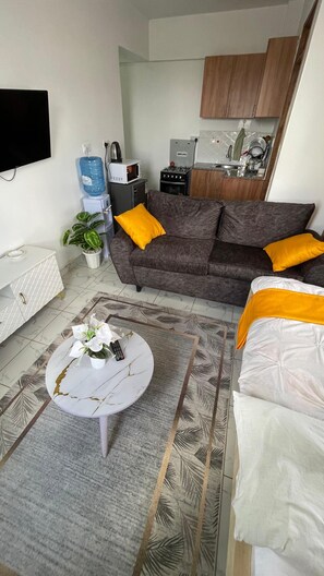 Monolocale Deluxe, vista città | Area soggiorno