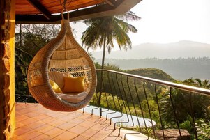 Suite familiar, balcón, vistas al jardín | Jardines del alojamiento