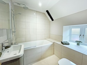 A modern bathroom with a shower, sink, and toilet. - The perfect base for exploring, relaxing and making unforgettable memories. (Burton, near Lincoln)