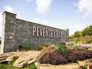 A stone wall with "PEVENSEY BAY HOTEL" signage. - Pevensey Bay Retreats (Pevensey Bay)