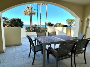 Outdoor dining - Enchanting beach apartment in Elviria - right by the sea, 1st row to the beach (Marbella)
