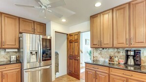 A kitchen with wooden cabinets, stainless steel appliances, and a tiled backsplash. - 26 Mi to Metlife & Nyc: 1 mi to Train (Scotch Plains)