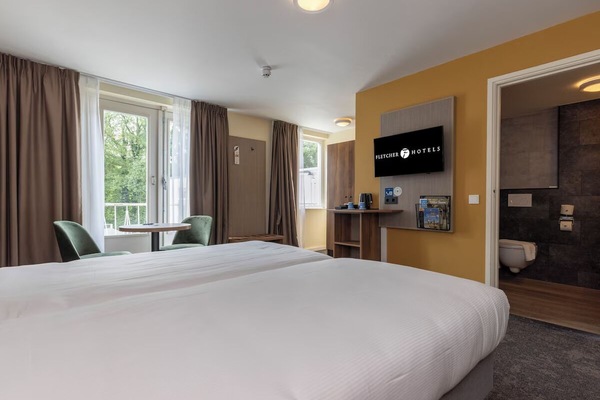 Wake up to greenery outside and relax in quiet comfort indoors.