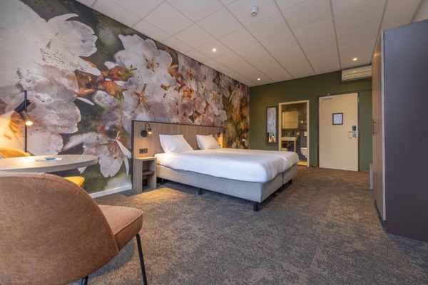 Lounge comfortably in a roomy suite with warm ambient lighting.