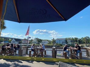 Outdoor dining - Comfortable 2-bedroom condo in serene Little River (Little River)