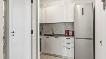 Apartemen Standar, balkon, pemandangan laut | Dapur pribadi