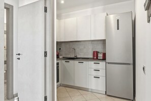 Departamento estándar, balcón, vista al mar | Cocina privada